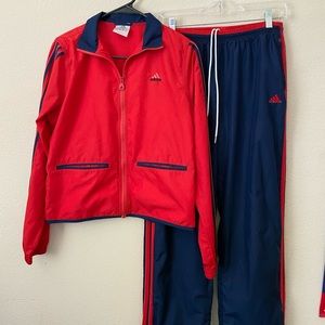 Red and blue Adidas track suit